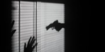silhouette of person on window