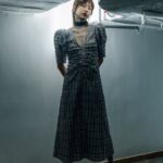 a person standing in front of a plane