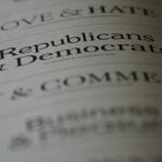 Close-up of blurred text page with 'Republicans & Democrats', focusing on political themes.