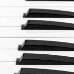 Detailed close-up of piano keys showcasing the contrast between black and white keys.