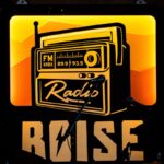 Retro radio sign with microphones and drums at a Boise music venue, highlighting local vibes.