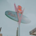 Iconic Flo's V8 Cafe sign in Disneyland, capturing a classic American diner style.