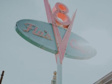 Iconic Flo's V8 Cafe sign in Disneyland, capturing a classic American diner style.
