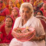 Devotees in Rishikesh celebrating a Hindu religious ceremony with traditional attire.