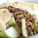 Close-up of a nutritious fruit and granola yogurt bowl, perfect for a healthy breakfast.