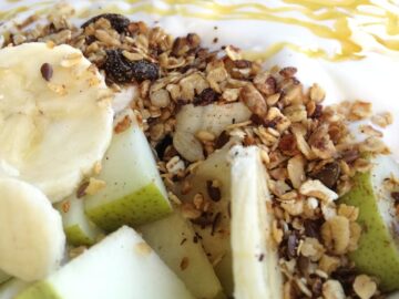 Close-up of a nutritious fruit and granola yogurt bowl, perfect for a healthy breakfast.