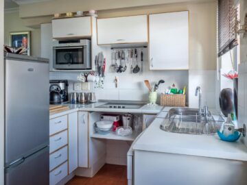 Sophisticated kitchen interior with modern appliances, wooden accents, and functional design.