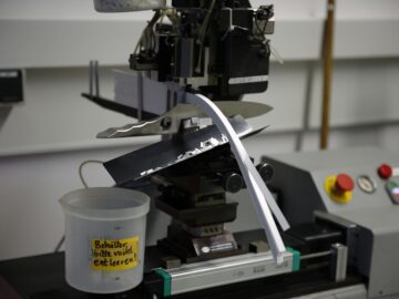 Close-up of knife testing machine in Solingen, showcasing precision engineering.