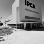 Black and white photo of IPCA's modern facade, showcasing urban design in Braga, Portugal.