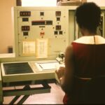 woman sitting on chair near white table