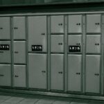 Secure metal lockers with electronic payment system at a station.