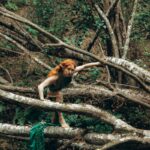 A mystical character navigates through an overgrown forest, exuding fantasy vibes.