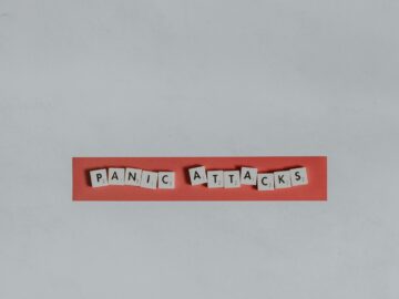 a red piece of paper with the words panic attacks spelled on it
