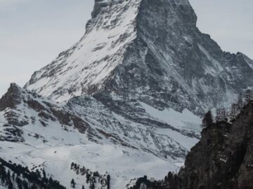 Stunning view of the snowcapped Matterhorn in Zermatt, showcasing its winter beauty and natural grandeur.
