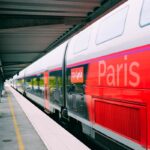A sleek TGV train at a Paris railway station, showcasing modern design in public transportation.
