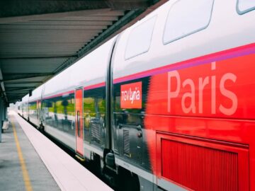 A sleek TGV train at a Paris railway station, showcasing modern design in public transportation.
