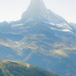 A breathtaking view of the Matterhorn mountain peak in Zermatt, Switzerland under a clear blue sky.