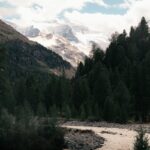 Beautiful mountain view with river and pine trees in Zermatt, Switzerland.
