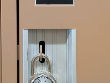 Close-up of a school locker with a secure combination padlock for safety and privacy.