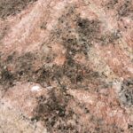Detailed view of a granite rock surface showcasing natural textures and patterns.