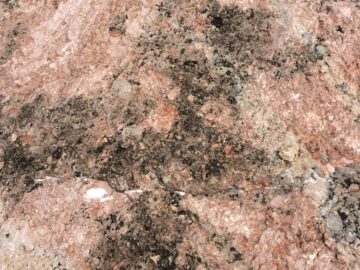 Detailed view of a granite rock surface showcasing natural textures and patterns.