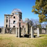 Captured at Hiroshima Peace Memorial Park showcasing the iconic Atomic Bomb Dome under a clear blue sky.