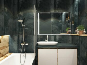 A contemporary bathroom showcasing black marble walls, clean lines, and modern fixtures, exuding luxury and style.