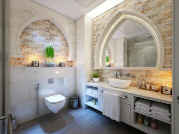 Elegant modern bathroom with marble tiles, ambient lighting, and stylish decor.