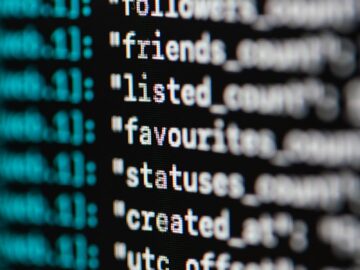 Extreme close-up of computer code displaying various programming terms and elements.