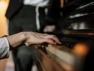 A person playing piano indoors during a relaxed day, showcasing a cozy home ambiance.