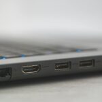 Detailed view of laptop ports including HDMI, USB, and Ethernet, showcasing connectivity options.