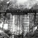 grayscale photo of metal tower