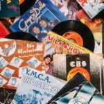 A flat lay of vintage vinyl record covers showcasing 70s and 80s music nostalgia.
