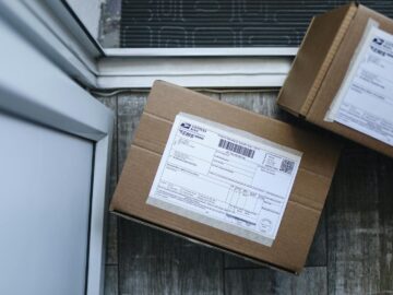 Close-up of a package delivery box on a doorstep, highlighting logistics concepts.