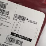 Detailed view of a blood bag labeled Rh D Negative for medical donation purposes.