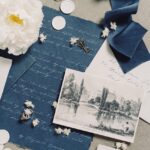 Elegant vintage still life featuring letters, ribbon, and floral elements creating nostalgic ambiance.