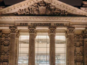 Majestic night view of the Reichstag building in Berlin, showcasing its grand architecture.