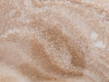 Elegant close-up of granite stone texture, perfect for backgrounds and design projects.