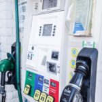 Close-up of a modern gas pump at a Los Angeles fuel station showing fuel options and digital display.