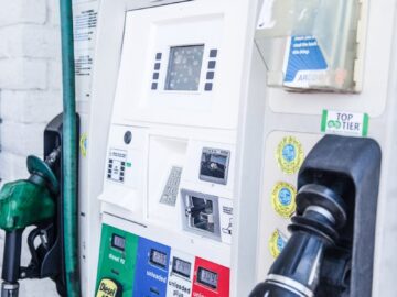 Close-up of a modern gas pump at a Los Angeles fuel station showing fuel options and digital display.