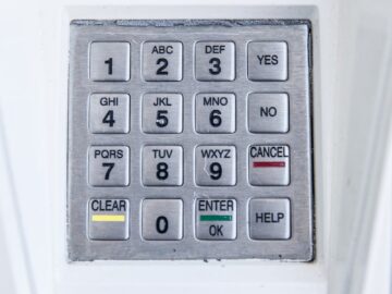 Detailed view of a secure electronic keypad with numbers and letters.