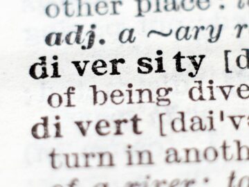 Macro shot of the word 'diversity' in a dictionary with crisp focus on text.