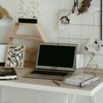 Stylish home office workspace featuring a laptop, desk decor, and practical office supplies.