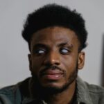 Close-up of a man with visual impairment demonstrating independence and strength.