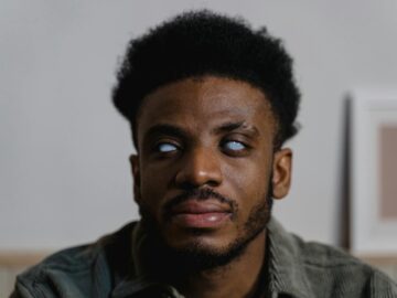 Close-up of a man with visual impairment demonstrating independence and strength.