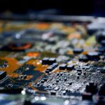 Detailed close-up view of electronic circuit board, showcasing modern technology.