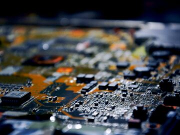 Detailed close-up view of electronic circuit board, showcasing modern technology.