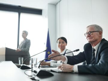Panelists at an EU conference discussing law and diplomacy.
