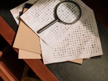 A vintage office scene with cryptic documents and a magnifying glass, evoking mystery and detective work.