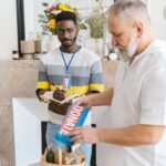 Volunteer oversees charity donation process in an indoor setting.